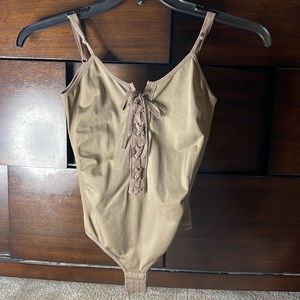 S/M brown lace up body suit from Discovery Clothing